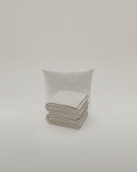Bouclé fabric-covered decorative cushion 